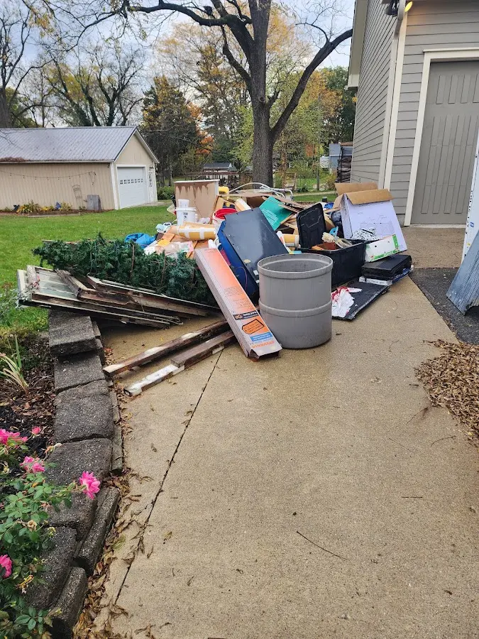 Dumpster being loaded with debris for 30 Yard Dumpster Rental in Franklin